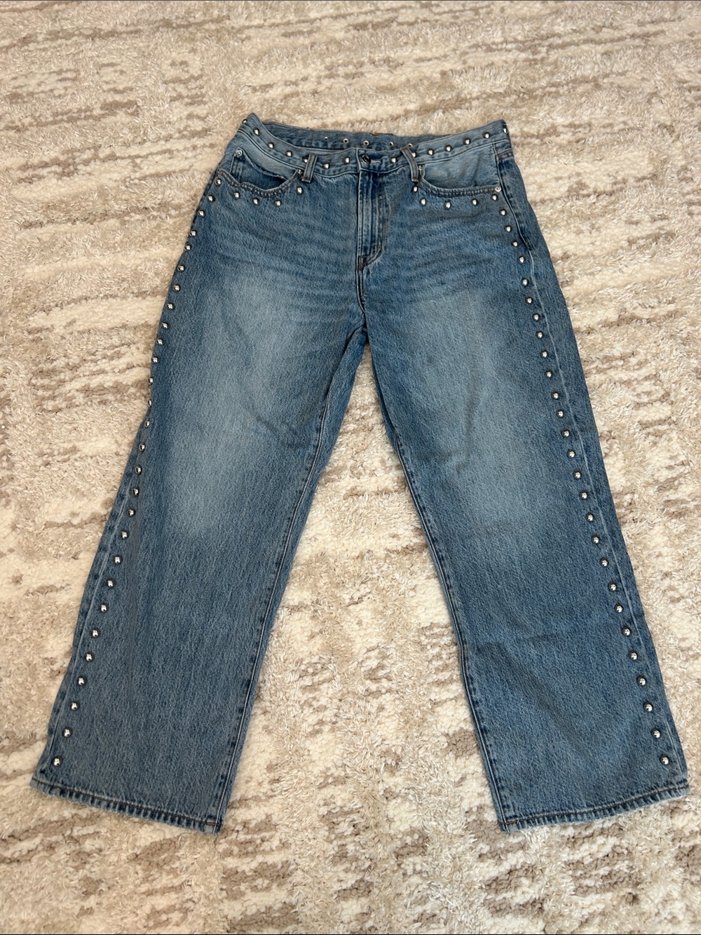 Pistol studded blue jeans
